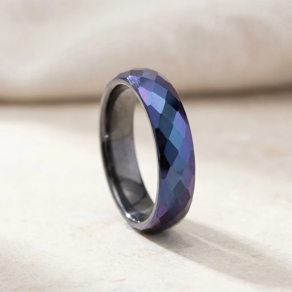 Faceted, anodised, Cut into facets, then coloured, so each plane catches differently.